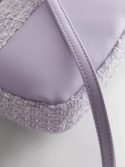 Bandolera de bouclé con colgante de corazón