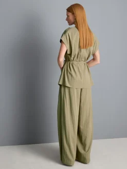 Blusa con cuello drapeado y lazada