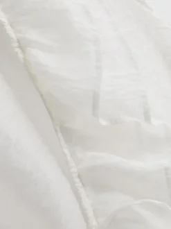 Blusa transparente con volantes