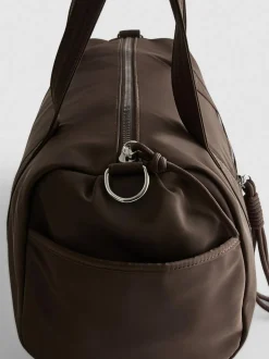 Bolso cilíndrico con bolsillo y cremallera