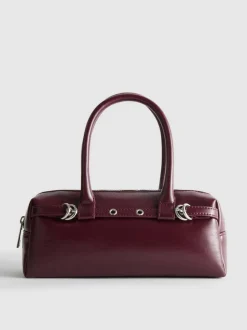 Bolso de hombro con detalle de ojales
