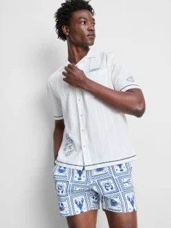 Camisa de cuello con solapas y bordado de peces