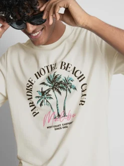 Camiseta con estampado gráfico «Paradise Beach»