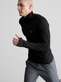 Camiseta deportiva con cremallera de 1/4