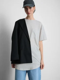 Camiseta larga con bolsillo de parche