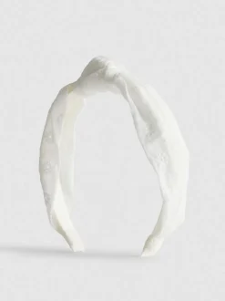 Diadema con nudo y bordado inglés
