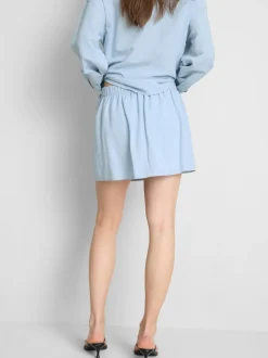 Falda pantalón corta en mezcla de lino con lazada