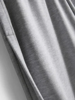 Joggers de pernera ancha plisados con algodón