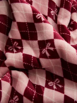 Manta con lazos y estampado a rombos Argyle