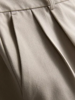 Pantalón plisado de pernera ancha