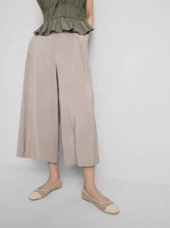 Pantalones anchos tipo culotte de talle medio