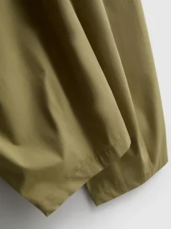 Pantalones bombachos con pinzas de tacto suave