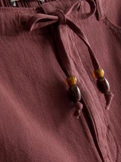 Pantalones cortos con cordón de ajuste con cuentas