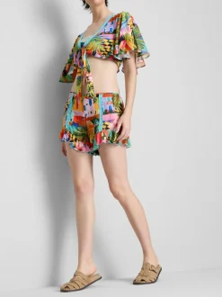 Pantalones cortos con volantes y estampado tropical