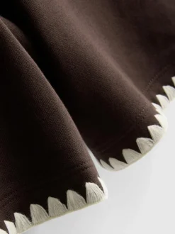 Pantalones cortos de algodón con ribete de crochet