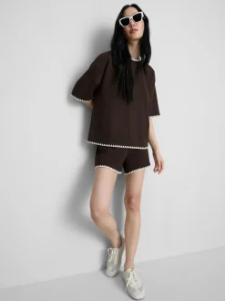 Pantalones cortos de algodón con ribete de crochet