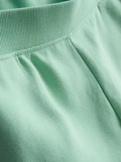 Pantalones cortos de algodón con bajo abierto