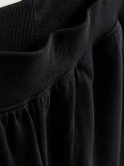 Pantalones cortos de algodón con bajo abierto