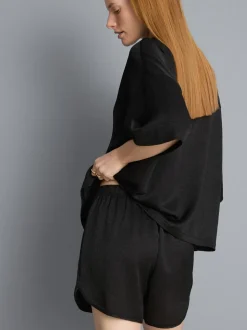Pantalones cortos deportivos de satén holgados