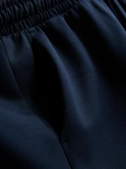 Pantalones de chándal anchos con cordón de ajuste