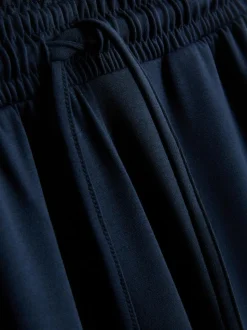 Pantalones de chándal anchos con cordón de ajuste