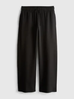 Pantalones de chándal anchos con aplicación