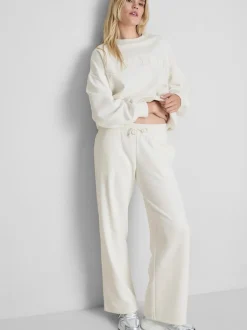 Pantalones de chándal anchos con aplicación