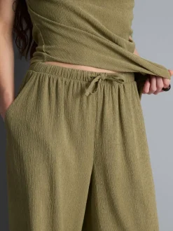 Pantalones de pernera ancha con efecto arrugado