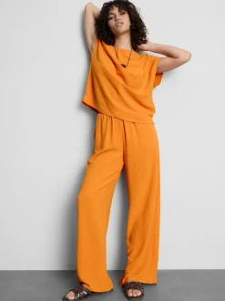 Pantalones de pernera ancha con cintura elástica