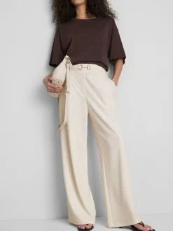 Pantalones de pernera ancha con detalle dorado