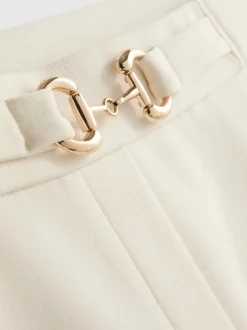 Pantalones de pernera ancha con detalle dorado