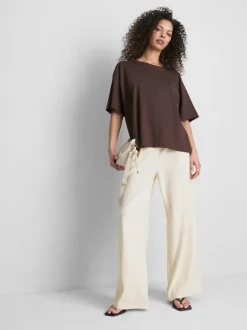 Pantalones de pernera ancha con detalle dorado