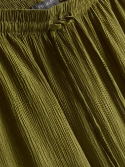 Pantalones de pernera ancha con efecto arrugado