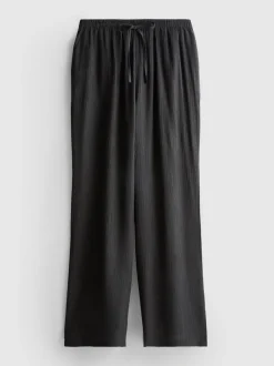 Pantalones de pernera ancha con efecto arrugado