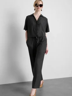 Pantalones de pernera ancha con efecto arrugado