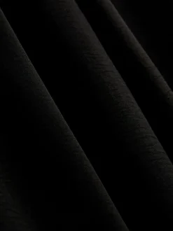 Pantalones de pernera ancha con cintura elástica