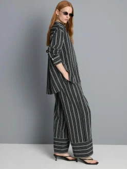 Pantalones de pernera ancha texturizados a rayas