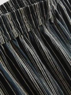 Pantalones de pernera ancha texturizados a rayas