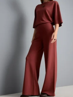Pantalones de punto plisados de pernera ancha