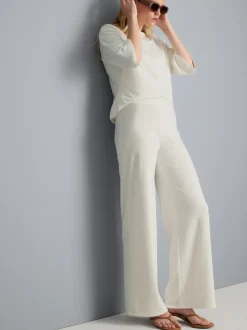 Pantalones de punto plisados de pernera ancha