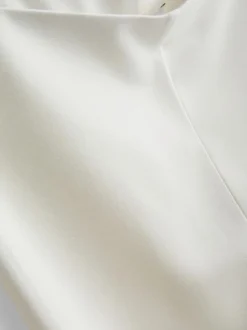 Pantalones de punto plisados de pernera ancha