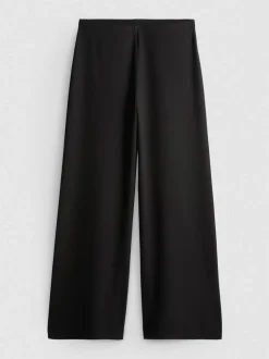 Pantalones de punto plisados de pernera ancha