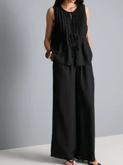 Pantalones fruncidos de pernera ancha