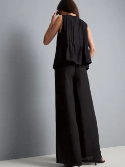 Pantalones fruncidos de pernera ancha