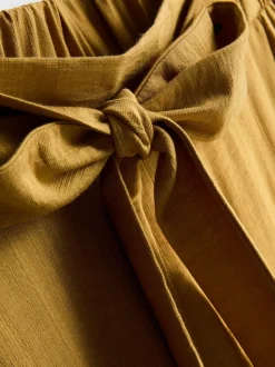 Pantalones palazzo con detalle de lazo
