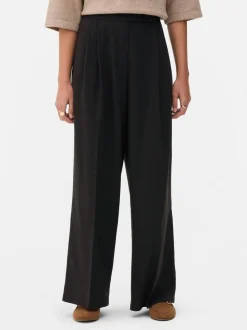 Pantalones plisados de talle medio
