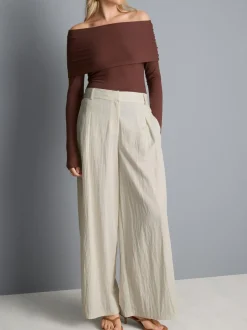 Pantalones plisados fruncidos de pernera ancha