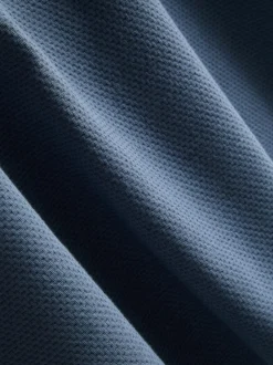 Polo con textura y cuello con cremallera