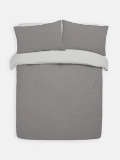 Set de cama reversible con sábana bajera