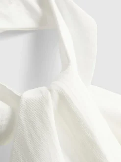 Top con cuello halter, botones y textura